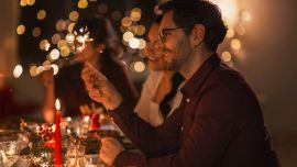 People holding sparklers in a festive atmosphere