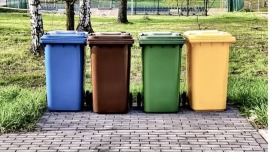 Four garbage bins in different colours